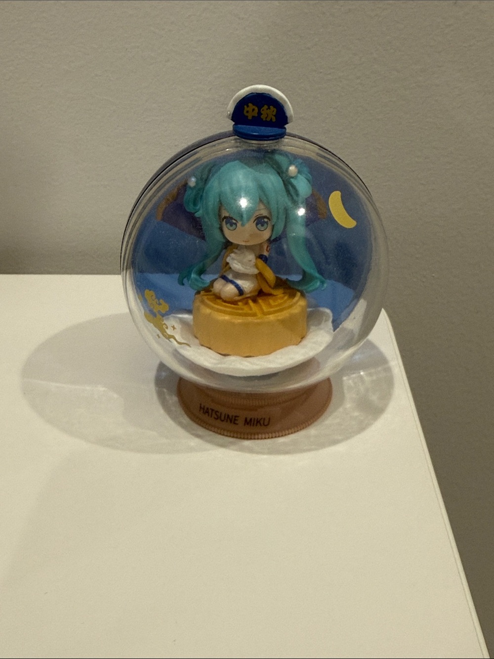 Hatsune Miku Capsule Figure - Teal Hair, Blue & Yellow Display